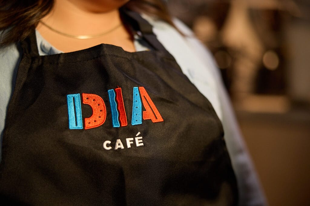 dia_cafe_apron_ambient_skies